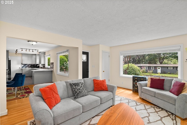 4545 SW Poplar Ln, Portland, OR 97225 - living room with light wood-style floors and a textured ceiling