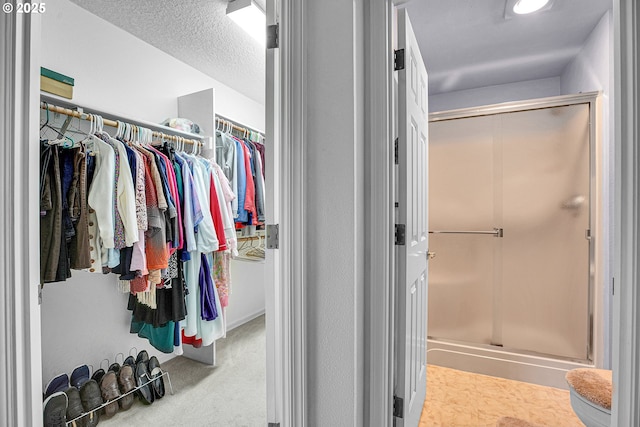 12459 SE Imperial Crest St, Happy Valley, OR 97086 - full bathroom with a shower stall and a walk in closet