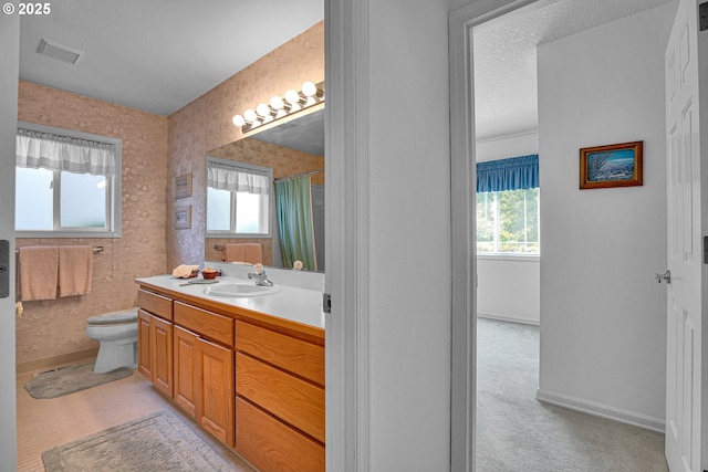12459 SE Imperial Crest St, Happy Valley, OR 97086 - full bathroom featuring healthy amount of natural light, vanity, toilet, and baseboards