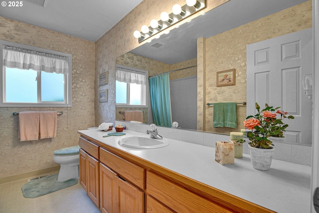 12459 SE Imperial Crest St, Happy Valley, OR 97086 - full bath with toilet, wallpapered walls, vanity, and a shower with shower curtain