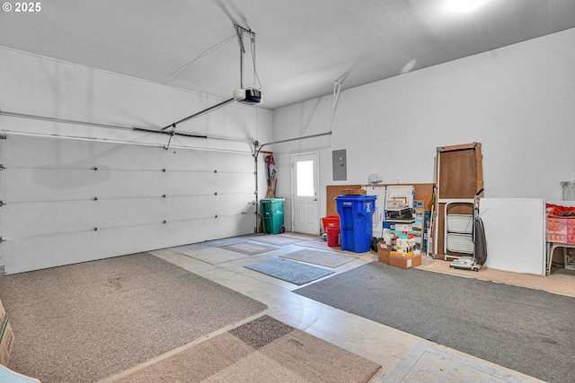 12459 SE Imperial Crest St, Happy Valley, OR 97086 - garage featuring electric panel and a garage door opener
