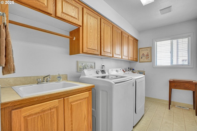 12459 SE Imperial Crest St, Happy Valley, OR 97086 - laundry room featuring washer and dryer, cabinet space, and light floors