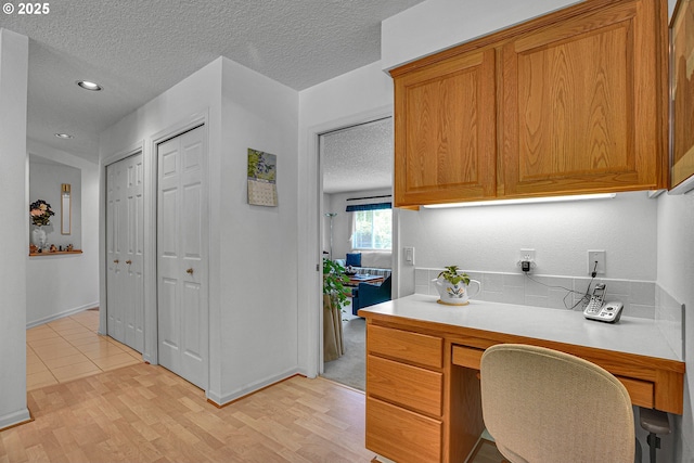 12459 SE Imperial Crest St, Happy Valley, OR 97086 - office space featuring a textured ceiling, light wood-style floors, recessed lighting, and baseboards