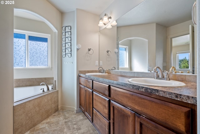 6916 NE 104th Way, Vancouver, WA 98686 - bathroom featuring a sink, double vanity, and a wealth of natural light
