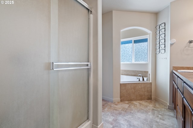 6916 NE 104th Way, Vancouver, WA 98686 - full bathroom with vanity, baseboards, a shower with shower door, and a garden tub