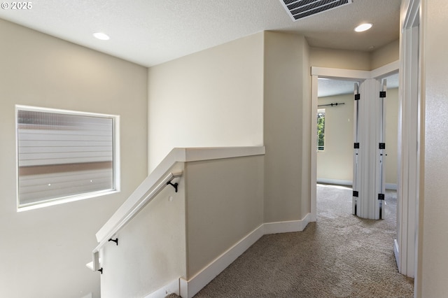 521 NE 77th Ave, Hillsboro, OR 97124 - corridor featuring carpet flooring, baseboards, recessed lighting, a textured ceiling, and an upstairs landing