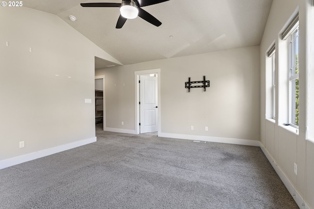 521 NE 77th Ave, Hillsboro, OR 97124 - carpeted spare room with a ceiling fan, vaulted ceiling, baseboards, and a smoke detector