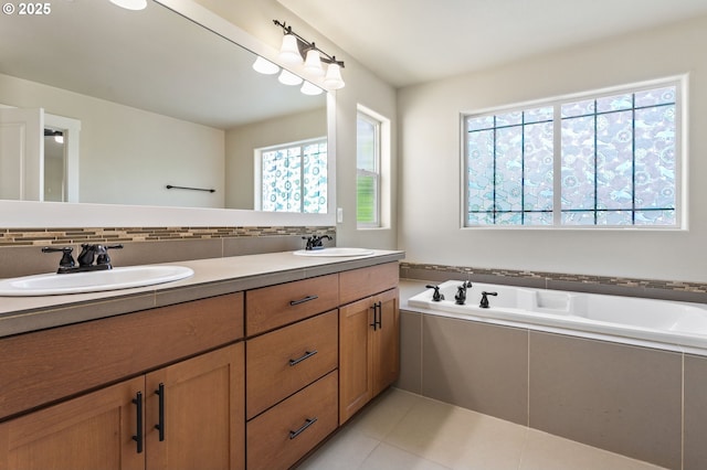 521 NE 77th Ave, Hillsboro, OR 97124 - full bath featuring healthy amount of natural light, double vanity, decorative backsplash, and tile patterned flooring
