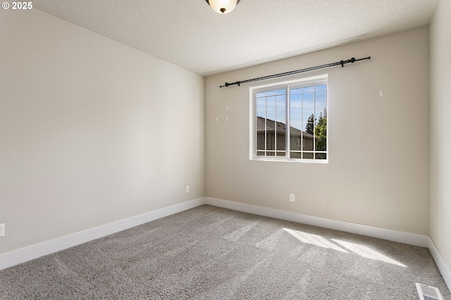 521 NE 77th Ave, Hillsboro, OR 97124 - unfurnished room featuring carpet, baseboards, and a textured ceiling