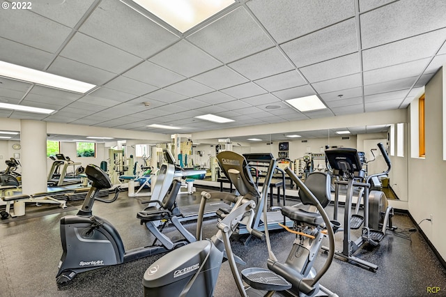 workout area featuring a drop ceiling