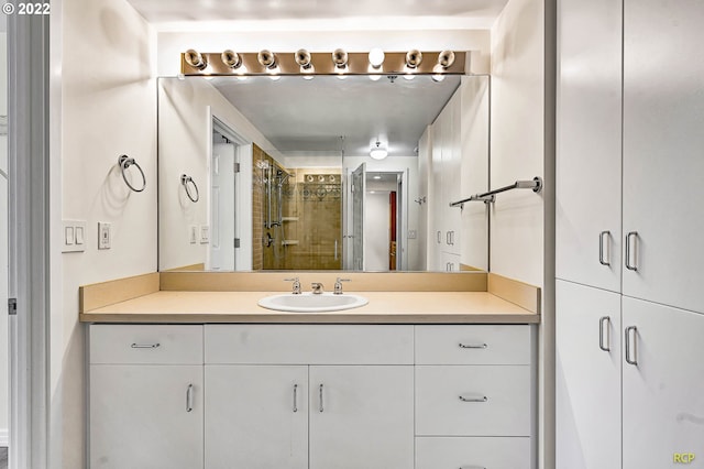 bathroom with vanity and an enclosed shower