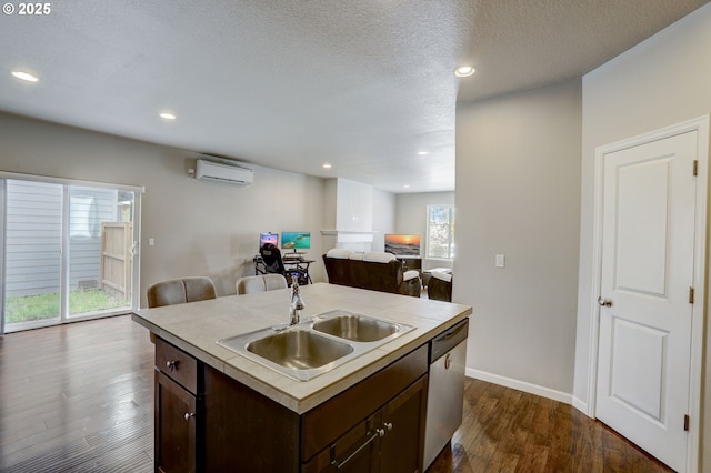 5141 SE Redberry Pl, Hillsboro, OR 97123 - kitchen with a wall mounted AC, dishwasher, dark brown cabinets, a sink, and dark wood-type flooring
