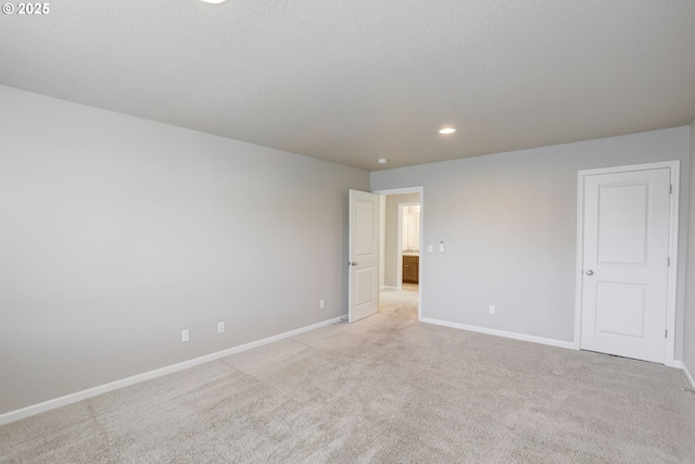 5141 SE Redberry Pl, Hillsboro, OR 97123 - unfurnished room featuring baseboards, light colored carpet, and recessed lighting