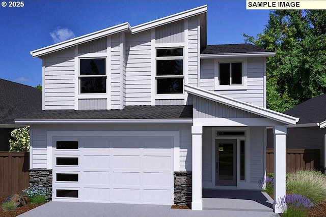 3831 S Arwana Ln, Ridgefield, WA 98642 - view of front facade featuring fence, stone siding, roof with shingles, concrete driveway, and an attached garage