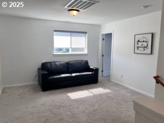 17095 SE Manley St, Portland, OR 97236 - carpeted living room featuring baseboards
