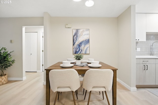 12620 NW Barnes Rd Unit 4, Portland, OR 97229 - dining room with light wood finished floors and baseboards