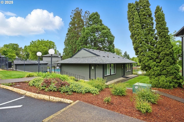 12620 NW Barnes Rd Unit 4, Portland, OR 97229 - view of front of house with a shingled roof and uncovered parking