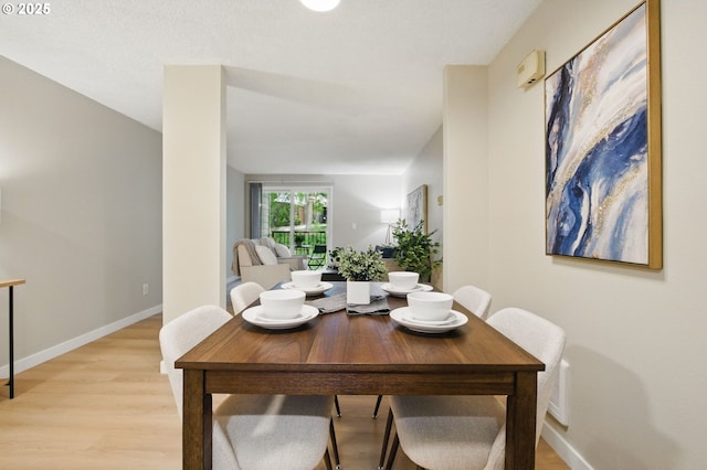 12620 NW Barnes Rd Unit 4, Portland, OR 97229 - dining room with light wood-style floors and baseboards