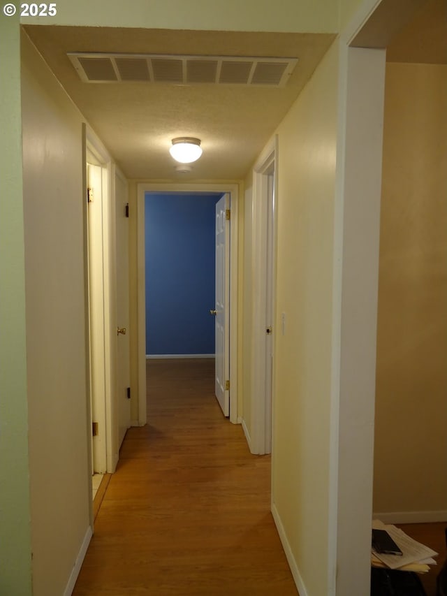 hall featuring light hardwood / wood-style floors