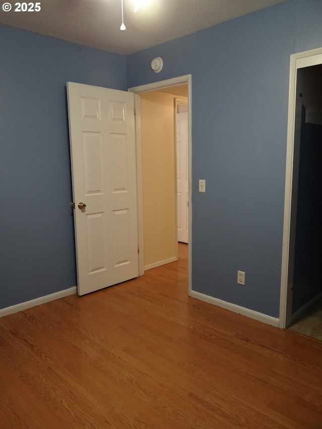 unfurnished bedroom featuring light hardwood / wood-style floors