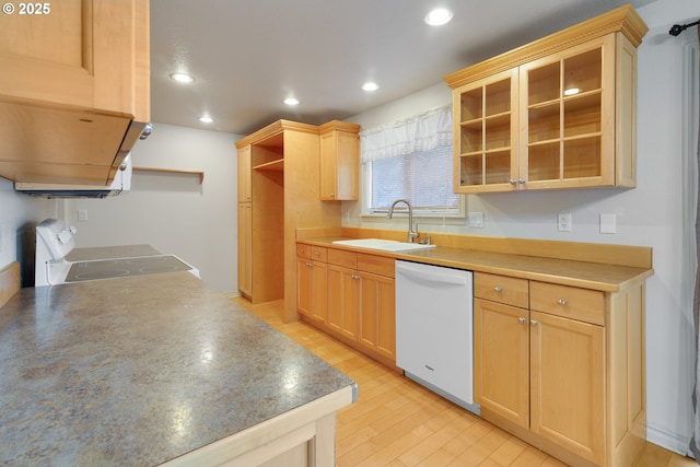 kitchen with dishwasher, stove, sink, and light brown cabinetry