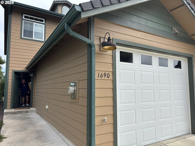 1690 32nd St, Florence, OR 97439 - view of home's exterior with a garage