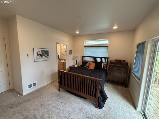 1690 32nd St, Florence, OR 97439 - bedroom with multiple windows, carpet flooring, connected bathroom, and recessed lighting
