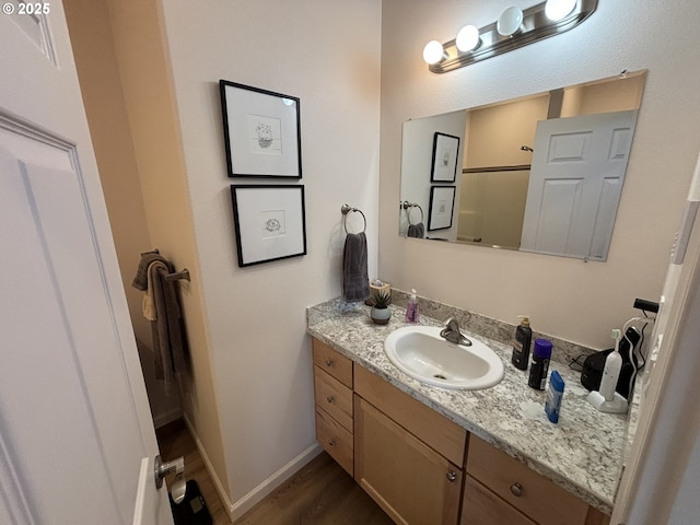 1690 32nd St, Florence, OR 97439 - bathroom with vanity and wood finished floors