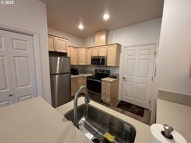 1690 32nd St, Florence, OR 97439 - kitchen with appliances with stainless steel finishes, light brown cabinetry, light countertops, and recessed lighting