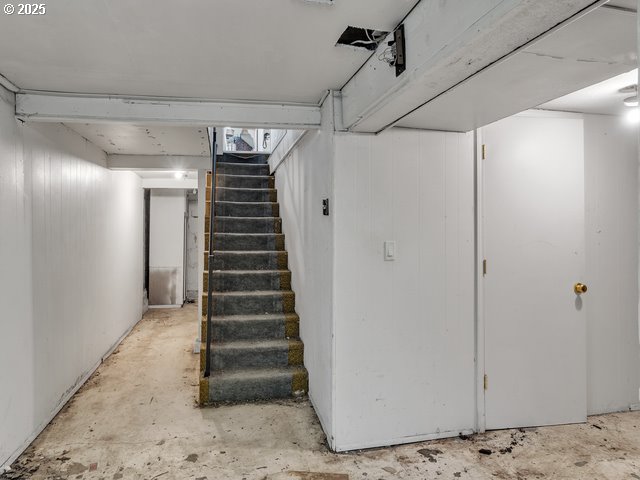 finished basement featuring stairs