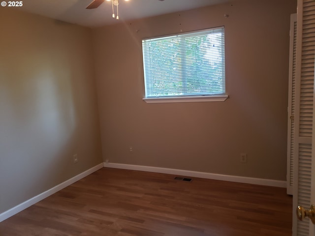 unfurnished bedroom featuring hardwood / wood-style floors and ceiling fan