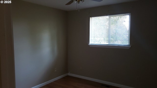 empty room featuring hardwood / wood-style floors and ceiling fan