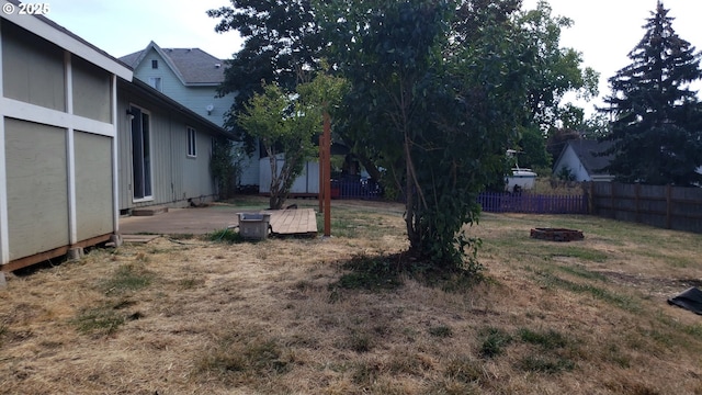 view of yard with a fire pit