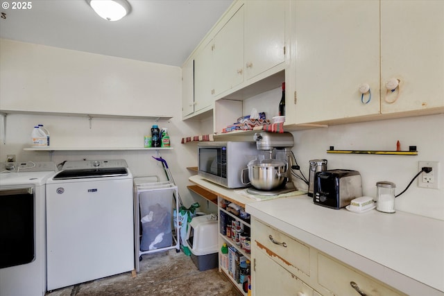 washroom featuring laundry area and independent washer and dryer