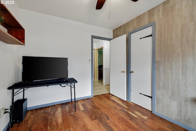 bedroom featuring ceiling fan and wood finished floors