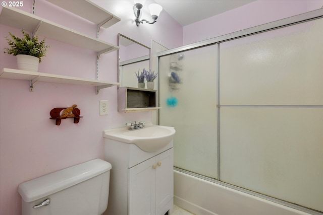 full bathroom featuring enclosed tub / shower combo, toilet, and vanity