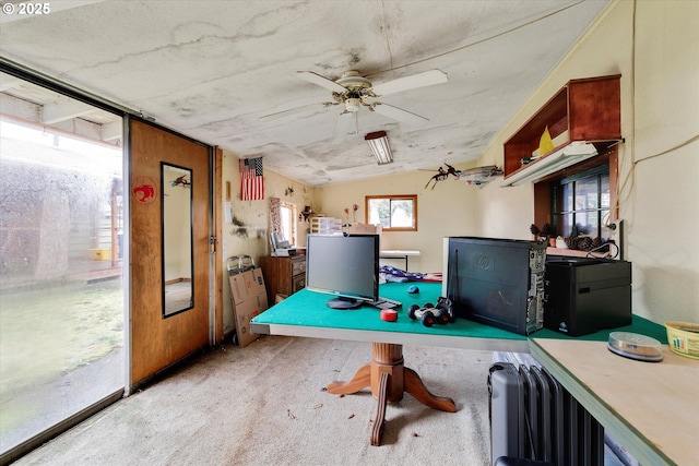 home office featuring vaulted ceiling and a ceiling fan