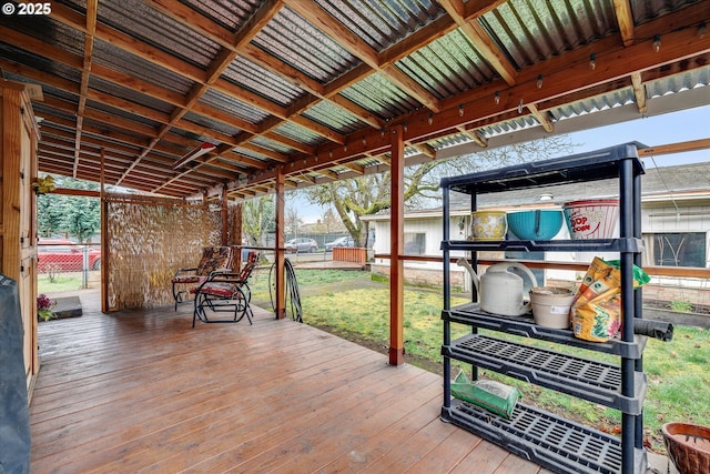 wooden deck with a lawn