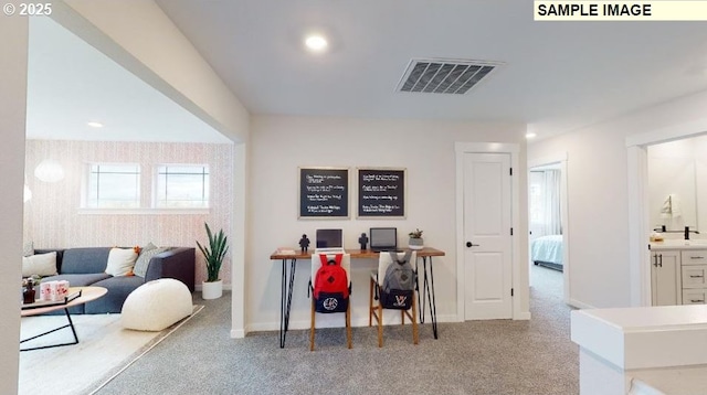 office area featuring sink and light carpet