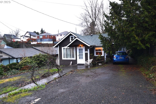 bungalow with a shingled roof