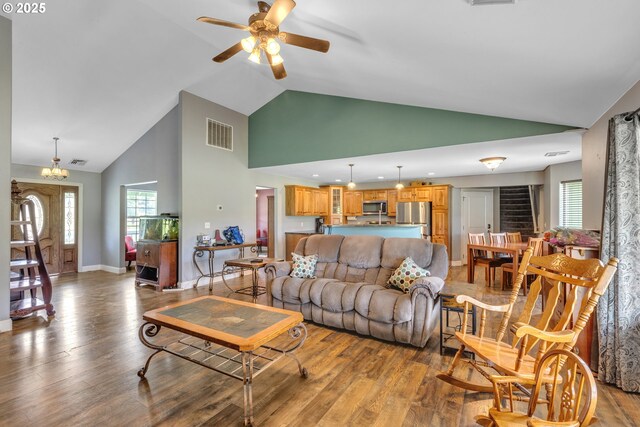 222 Twin Springs Ln, Roseburg, OR 97470 - living room with high vaulted ceiling, wood finished floors, a ceiling fan, plenty of natural light, and baseboards