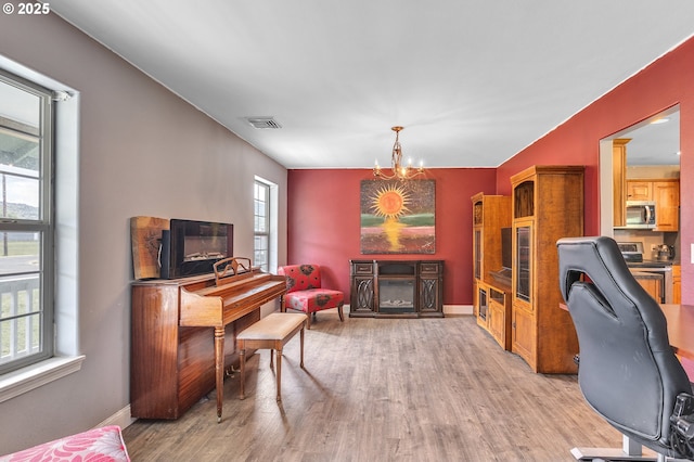222 Twin Springs Ln, Roseburg, OR 97470 - home office featuring light wood-style flooring, a chandelier, and baseboards