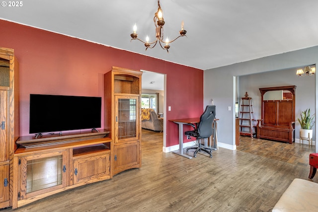 222 Twin Springs Ln, Roseburg, OR 97470 - home office featuring a chandelier, wood finished floors, and baseboards