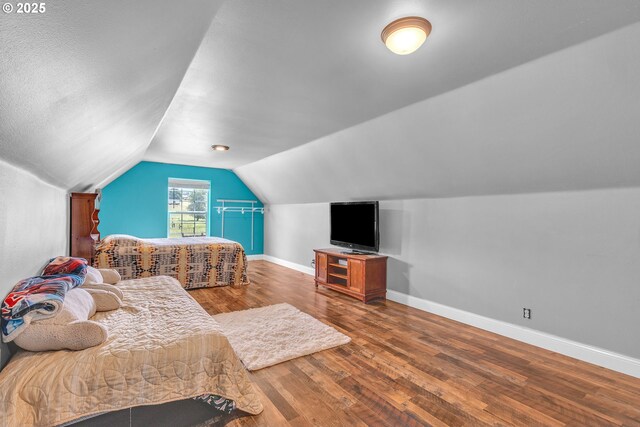 222 Twin Springs Ln, Roseburg, OR 97470 - bedroom with baseboards, hardwood / wood-style floors, and vaulted ceiling