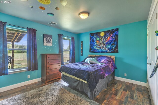 222 Twin Springs Ln, Roseburg, OR 97470 - bedroom with wood finished floors, multiple windows, and baseboards