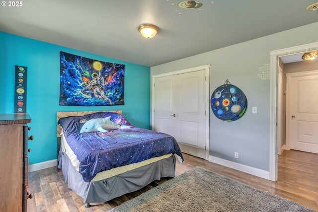 222 Twin Springs Ln, Roseburg, OR 97470 - bedroom with wood finished floors, a closet, and baseboards