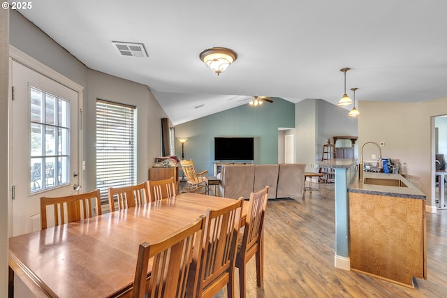 222 Twin Springs Ln, Roseburg, OR 97470 - dining room featuring light wood-style floors, lofted ceiling, a ceiling fan, and baseboards