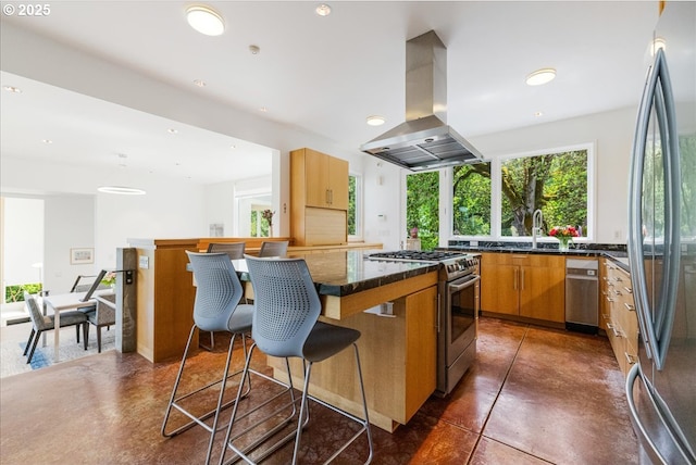 13440 SW Mccabe Chapel Rd, Mcminnville, OR 97128 - kitchen with appliances with stainless steel finishes, island range hood, a breakfast bar, a sink, and a kitchen island