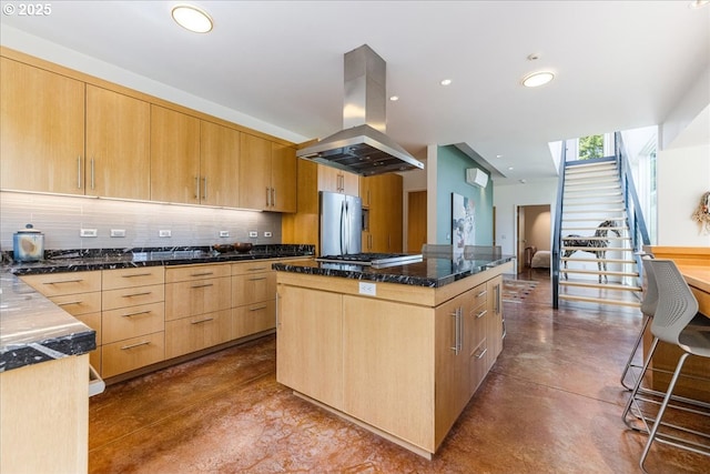 13440 SW Mccabe Chapel Rd, Mcminnville, OR 97128 - kitchen featuring island exhaust hood, appliances with stainless steel finishes, light brown cabinets, finished concrete flooring, and tasteful backsplash