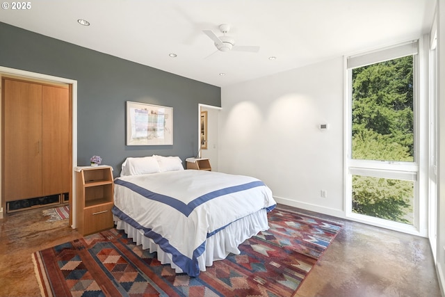 bedroom featuring recessed lighting, finished concrete flooring, ceiling fan, and baseboards